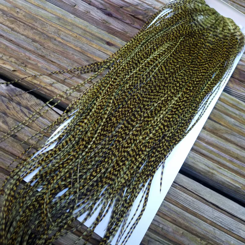 Whiting Pro-Grade Midge Rooster Saddle in Grizzly Dyed Olive B Approx tying size Stuffed with 14 16 you will find some 18 20 22 but you need to look for them.-1