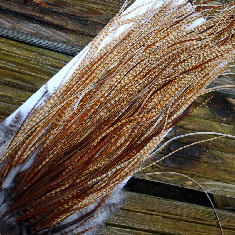 Whiting Heritage Hackles Rooster Saddle in Mixed Colours M Light/Medium and Dark Barred Ginger with a good splashing of Brassy Dun and a few Furnace down the centre Approx tying sizes 12/14/16/18-3