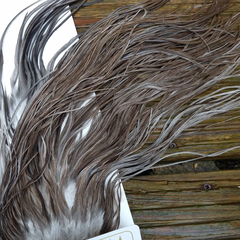 Whiting Heritage Hackles Rooster Saddle in Mixed Colours A Natural Dark Gray Dun/ Dark Blue Dun/ Iron Blue Dun Approx Tying Sizes 10/12/14 with the odd 16-5