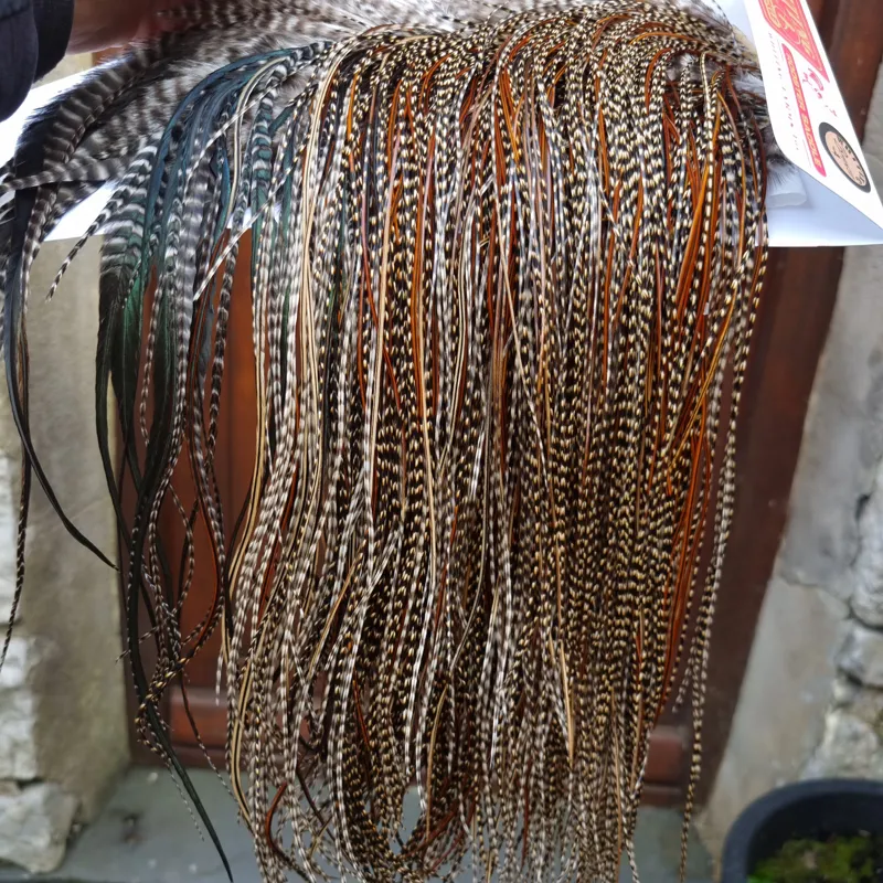 Whiting Bronze Grade Midge Rooster Saddle in CREE C Approx Tying Size Some 14 and stuffed with 16/18/20/22/24 and out of sight