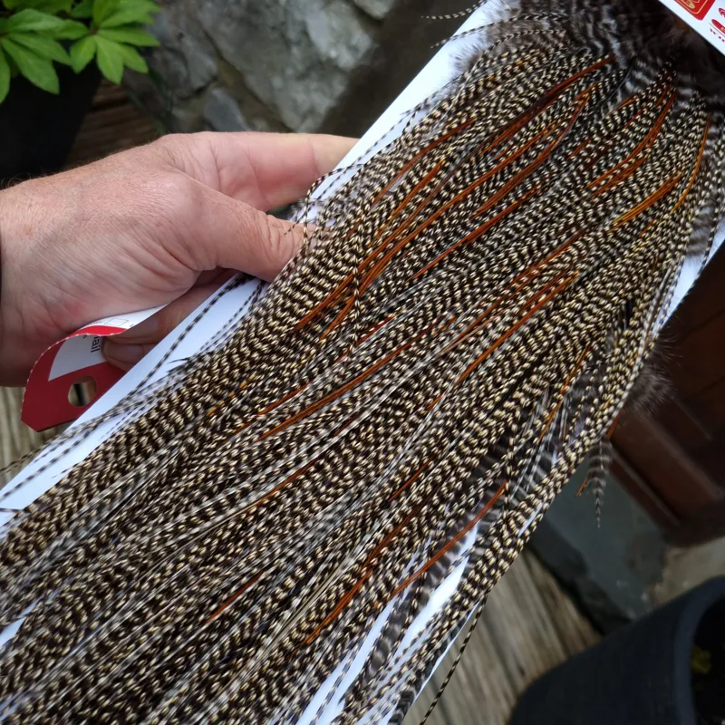 Whiting Pro-Grade Midge Rooster Saddle in CREE D CREE with a Light Splashing of Furnace Tying approx  14/16/18/20 and  a few smaller