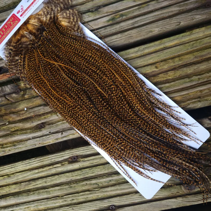 Whiting Pro-Grade Midge Rooster Saddle in Grizzly Dyed March Brown A Grizzly March Brown/ Lightly Splashed with Badger Dyed March Brown Approx Tying Sizes Few 14 and stuffed with 16/18/20/22 /24 and a few going smaller-5