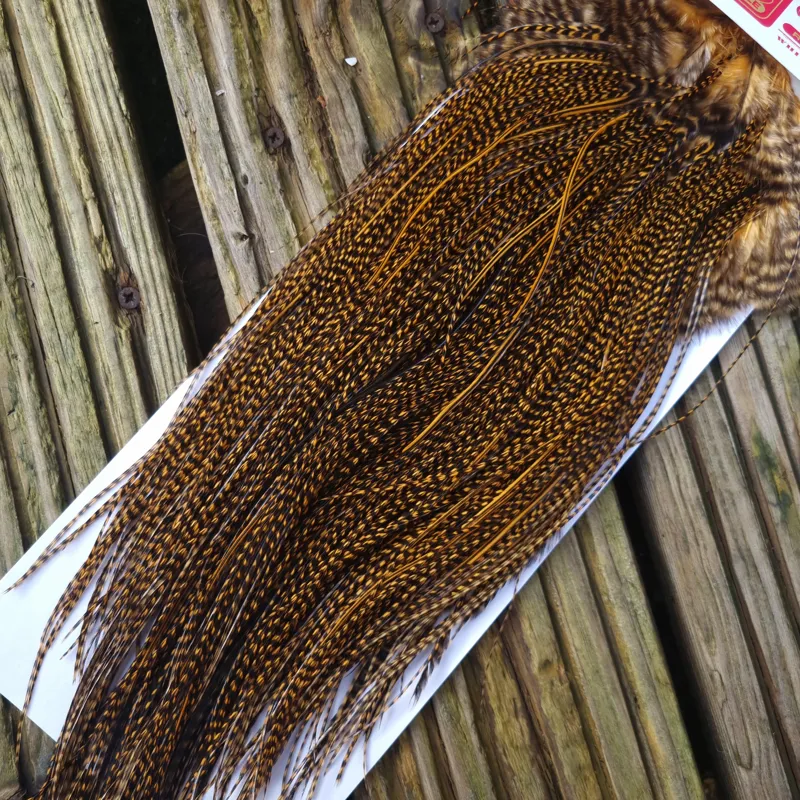 Whiting Pro-Grade Midge Rooster Saddle in Grizzly Dyed March Brown A Grizzly March Brown/ Lightly Splashed with Badger Dyed March Brown Approx Tying Sizes Few 14 and stuffed with 16/18/20/22 /24 and a few going smaller-2