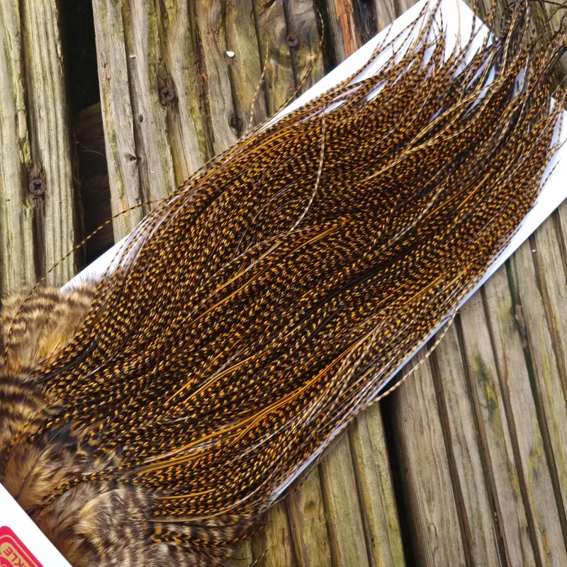 Whiting Pro-Grade Midge Rooster Saddle in Grizzly Dyed March Brown A Grizzly March Brown/ Lightly Splashed with Badger Dyed March Brown Approx Tying Sizes Few 14 and stuffed with 16/18/20/22 /24 and a few going smaller-6