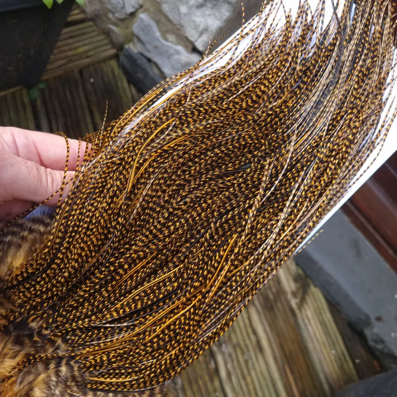 Whiting Pro-Grade Midge Rooster Saddle in Grizzly Dyed March Brown A Grizzly March Brown/ Lightly Splashed with Badger Dyed March Brown Approx Tying Sizes Few 14 and stuffed with 16/18/20/22 /24 and a few going smaller-9