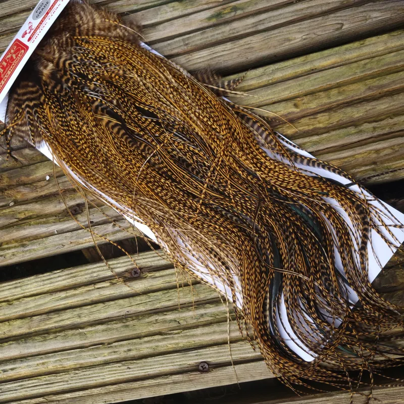 Whiting Pro-Grade Midge Rooster Saddle in Grizzly Dyed March Brown B Grizzly March Brown/Splashed with Badger March Brown Approx Tying Sizes  14 16 18 20 22 you might find a few smaller-4