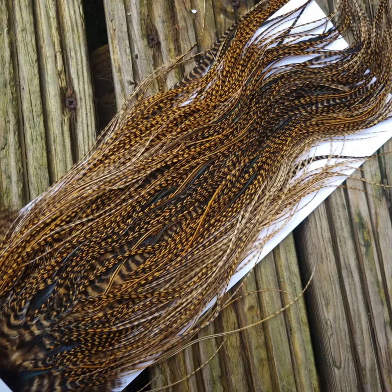 Whiting Pro-Grade Midge Rooster Saddle in Grizzly Dyed March Brown B Grizzly March Brown/Splashed with Badger March Brown Approx Tying Sizes  14 16 18 20 22 you might find a few smaller-8