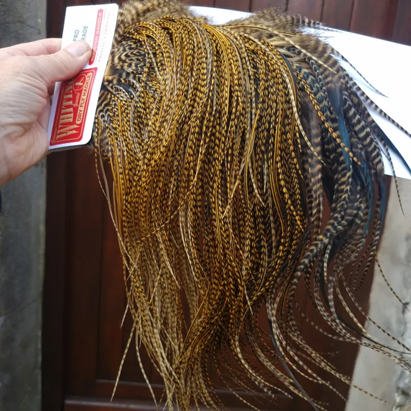 Whiting Pro-Grade Midge Rooster Saddle in Grizzly Dyed March Brown B Grizzly March Brown/Splashed with Badger March Brown Approx Tying Sizes  14 16 18 20 22 you might find a few smaller-7