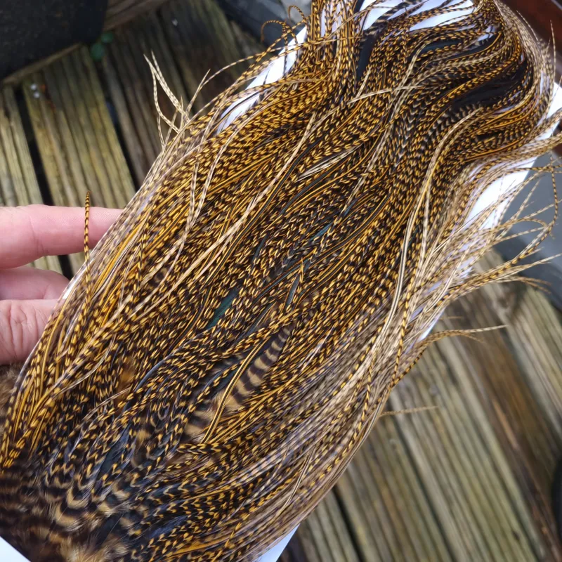 Whiting Pro-Grade Midge Rooster Saddle in Grizzly Dyed March Brown B Grizzly March Brown/Splashed with Badger March Brown Approx Tying Sizes  14 16 18 20 22 you might find a few smaller-1