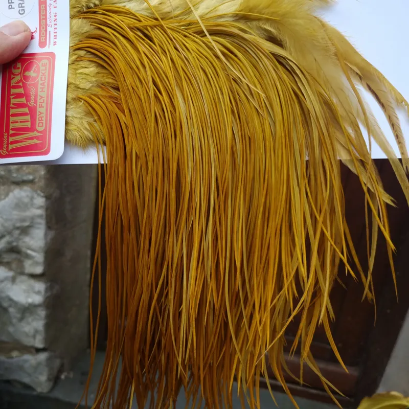 Whiting Pro-Grade Midge Rooster Saddle in White dyed Golden Olive A Approx Tying Size  Few 14 Stuffed with  16 18 20-2