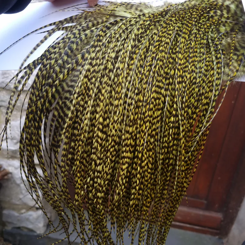 Whiting Pro-Grade Midge Rooster Saddle in Grizzly Dyed Olive B Approx tying size 14/16/18 and the odd one going smaller
