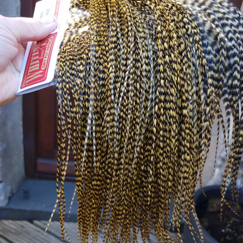 Whiting Pro-Grade Midge Rooster Saddle in Grizzly Golden Straw A Approx Tying Sizes Few 12's and stuffed with 14/16 with the odd one going smaller