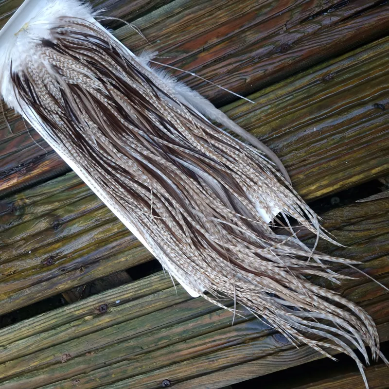 Whiting Heritage Hackles Rooster Saddle in Mixed Colours L Dun Grizzly Splashed with Natural Dun/ Chocolate Brown  Approx Tying Size 12/14/16 and a few 18	-1