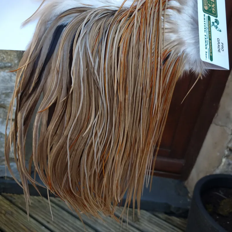 Whiting Hebert Miner Pro-Grade Dry Fly Rooster Saddle in Medium Brown Dun B Splashed with Rusty Dun Approx Tying Size 12/14