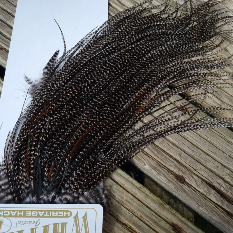 Whiting Heritage Hackles Rooster Saddle in Mixed Colours P Grizzly Variant/Dark Grizzly with a very light Splashing of Natural Black and Furnace  Approx Tying Size 10/12/14-2