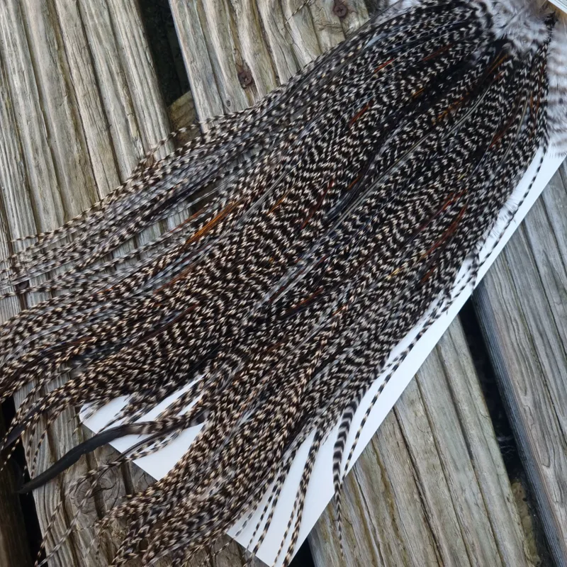 Whiting Heritage Hackles Rooster Saddle in Mixed Colours C Dark Grizzly Lightly Splashed with Natural Black/Furnace Hackles Tying Approx 10/12/14-4