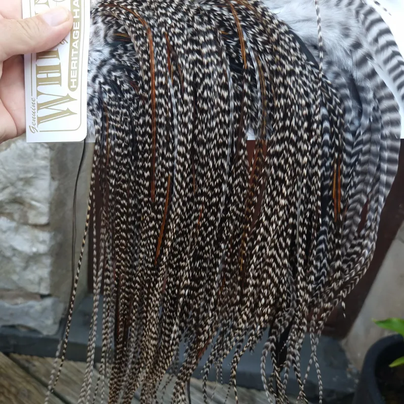 Whiting Heritage Hackles Rooster Saddle in Mixed Colours C Dark Grizzly Lightly Splashed with Natural Black/Furnace Hackles Tying Approx 10/12/14