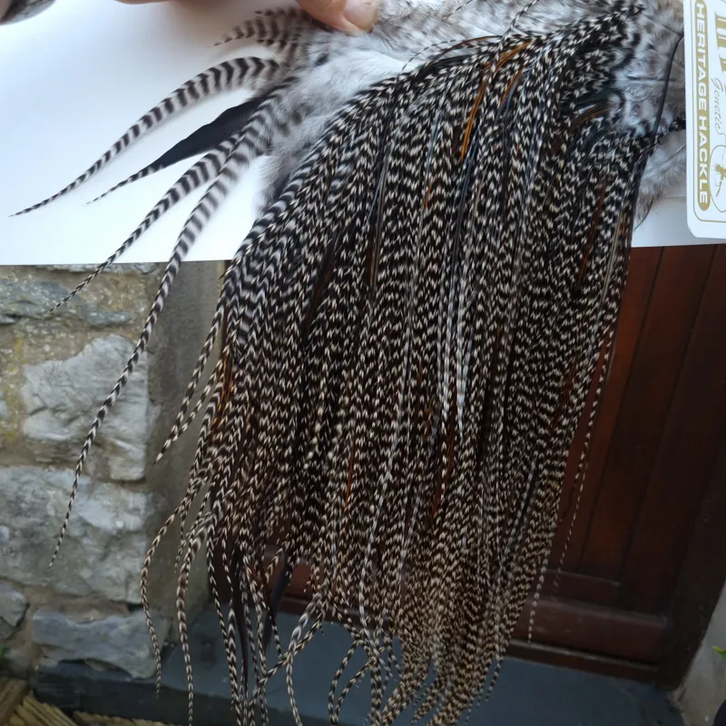 Whiting Heritage Hackles Rooster Saddle in Mixed Colours C Dark Grizzly Lightly Splashed with Natural Black/Furnace Hackles Tying Approx 10/12/14-3