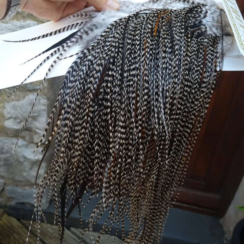Whiting Heritage Hackles Rooster Saddle in Mixed Colours C Dark Grizzly Lightly Splashed with Natural Black/Furnace Hackles Tying Approx 10/12/14-5