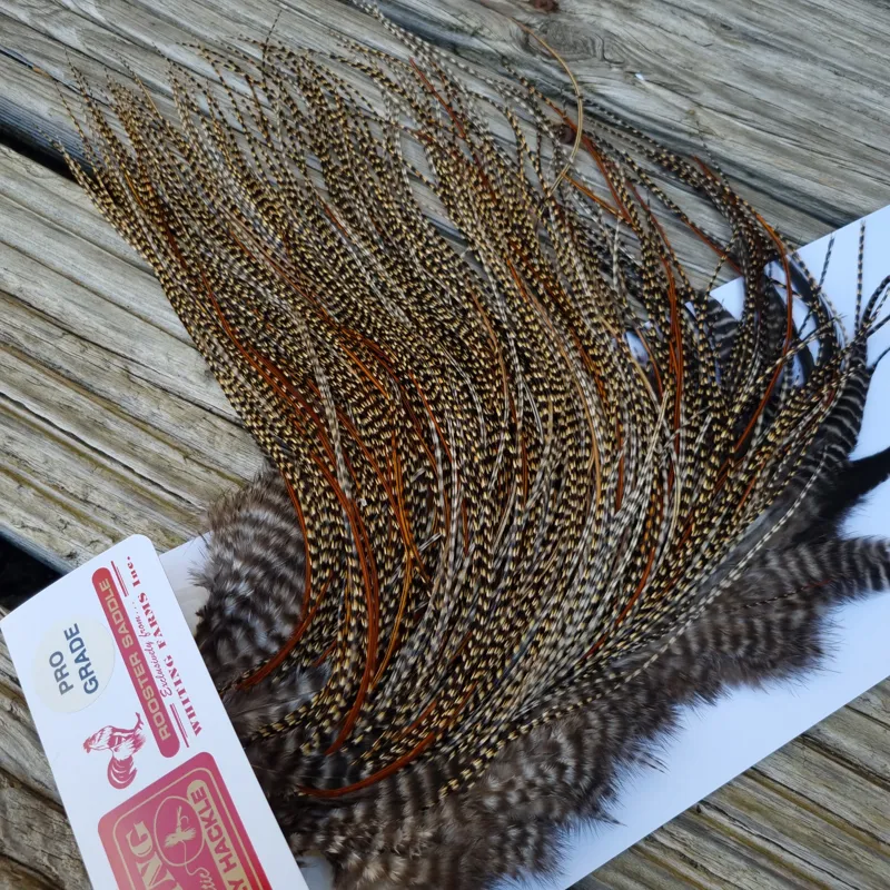 Whiting PRO-Grade Midge Rooster Saddle in CREE A Classic Cree Splashed with Furnace Approx tying size odd 14 and stuffed with 16/18/20-6