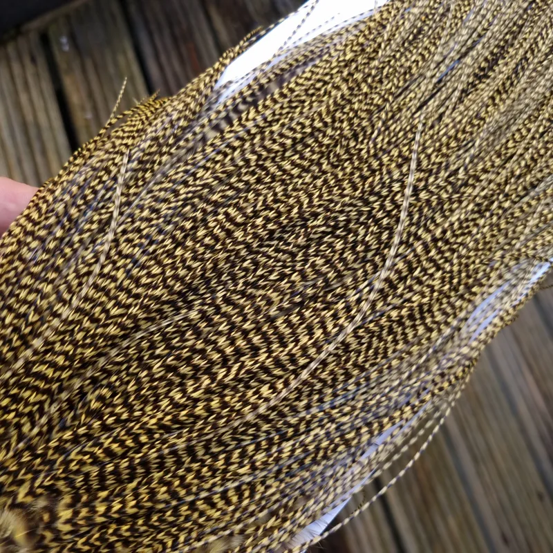 Whiting Pro-Grade Midge Rooster Saddle in Grizzly Dyed Pale Yellow B Approx Tying Size Few 14 and Stuffed with 16/18/20 with a few going Smaller-1