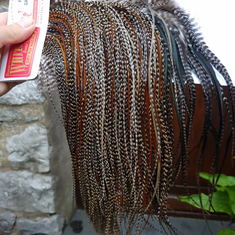 Whiting Pro-Grade Midge Rooster Saddle in Grizzly Variant B Dark Grizzly Splashed with Furnace/Red Game Hackles Approx Tying Sizes Few 14 and Stuffed with16/18/20/22 and out of sight-2