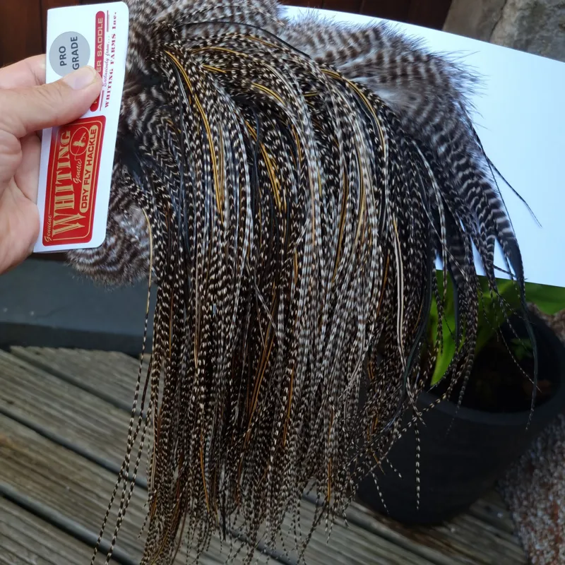 Whiting Pro-Grade Midge Rooster Saddle in Grizzly Variant E Dark Grizzly Splashed with Golden Badger Approx Tying Size 14/16/18-1