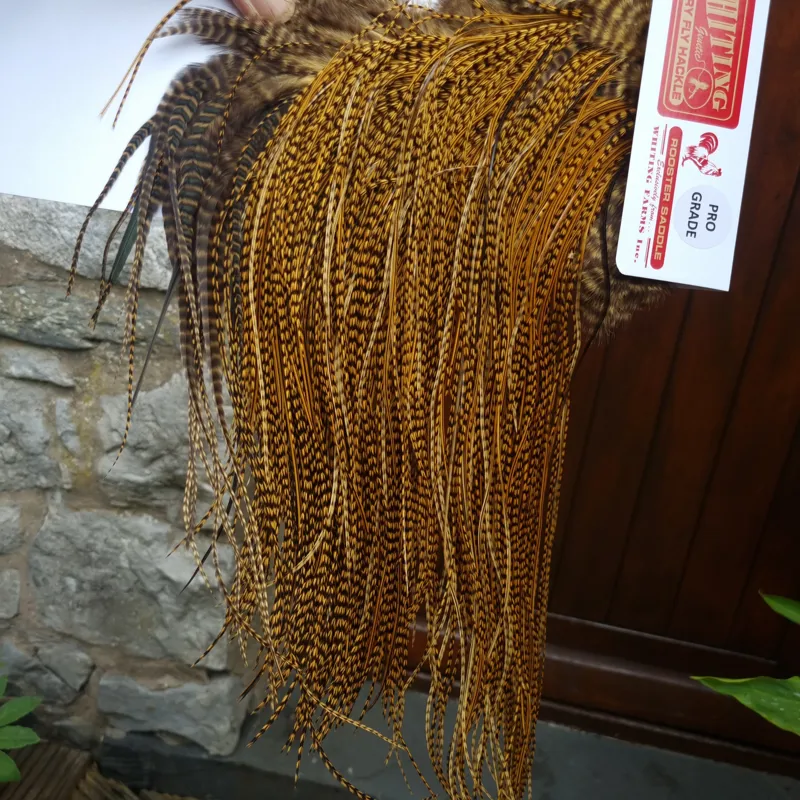 Whiting Pro-Grade Midge Rooster Saddle in Grizzly Dyed March Brown B Grizzly March Brown/Splashed with Badger March Brown Approx Tying Sizes  14 16 18 20 you might find a few smaller-9