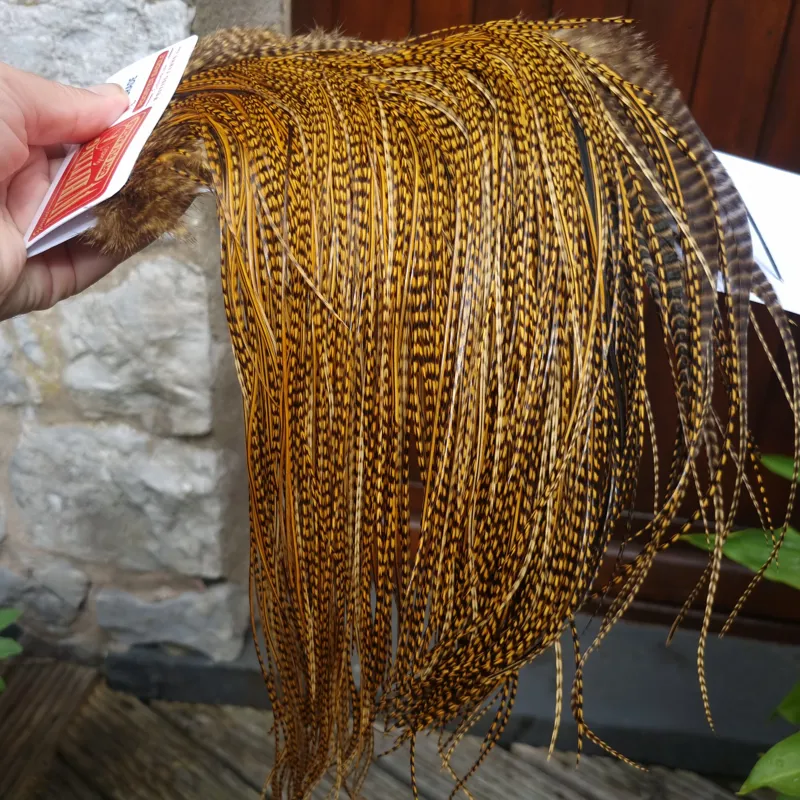 Whiting Pro-Grade Midge Rooster Saddle in Grizzly Dyed March Brown B Grizzly March Brown/Splashed with Badger March Brown Approx Tying Sizes  14 16 18 20 you might find a few smaller-3