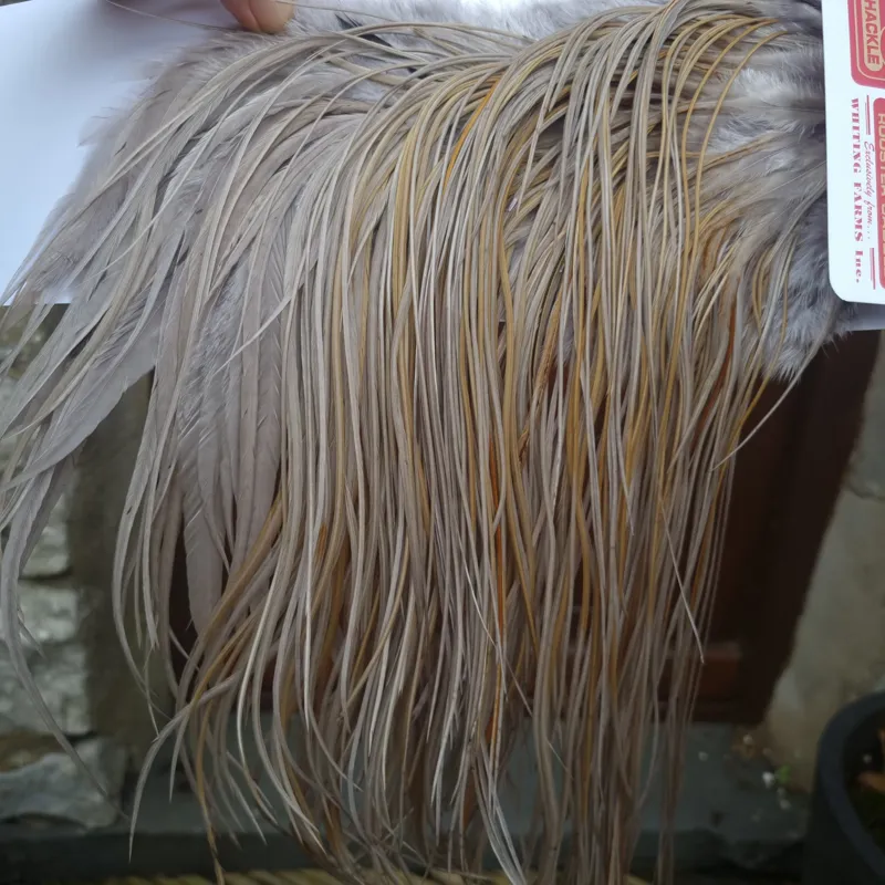 Whiting Pro-Grade Midge Rooster Saddle in Medium Dun A Medium Dun/Splashed with Sandy/Tan Dun Approx Tying Size odd 14 and stuffed with 16/18/20/22 and a few going smaller